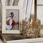 Nubia White Bone Ribbed Photo Frame featuring hand-carved white bone alongside a decorative candle holder.