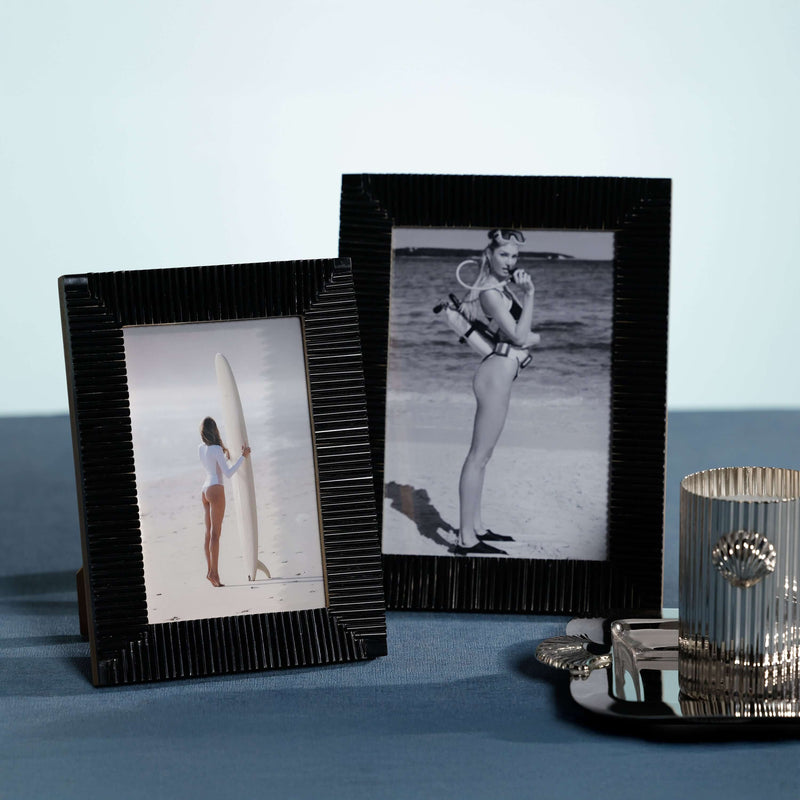 Nubia Black Bone Ribbed Photo Frame showcasing two photos of women by the beach, highlighting its elegant design.