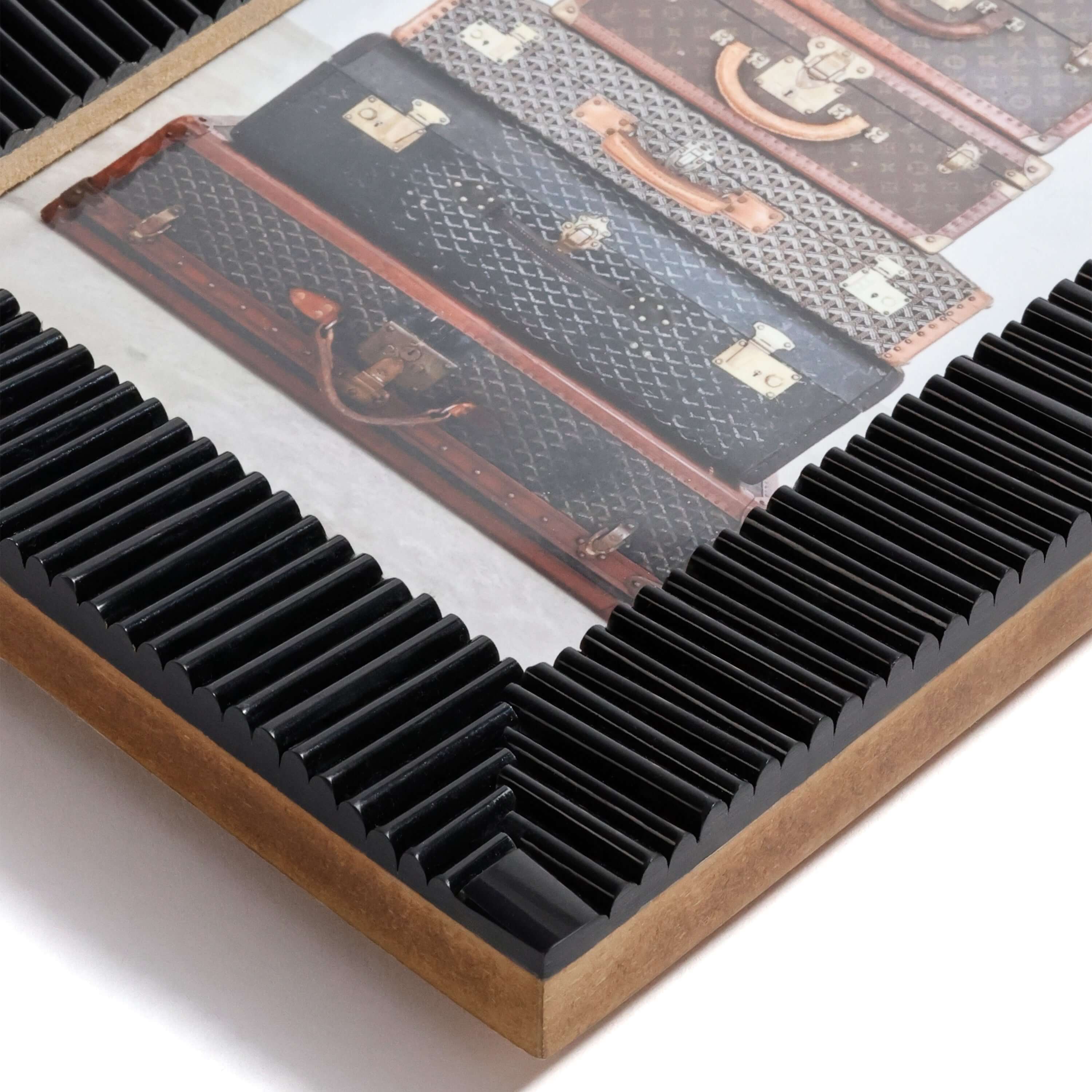 Nubia Black Bone Ribbed Photo Frame showcasing intricate ribbed design around vintage suitcase photo.
