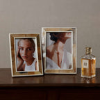 Haven Brown Horn with White Bone Border Photo Frame showcasing elegant photos and a stylish perfume bottle.