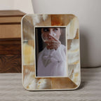 Decorative photo frame with a woman holding a glass of wine inside