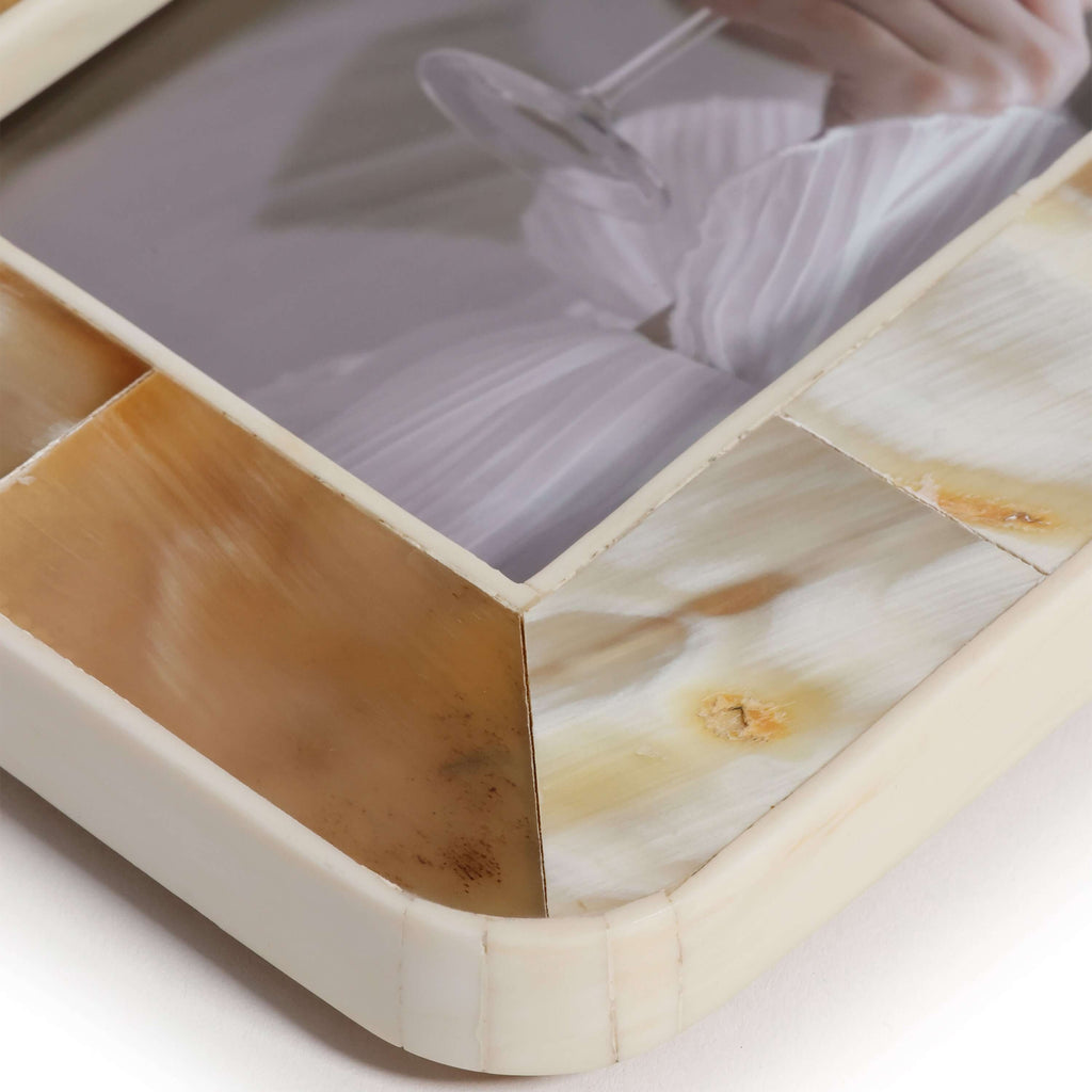 Close-up of a decorative box with marble-like surface and geometric design.