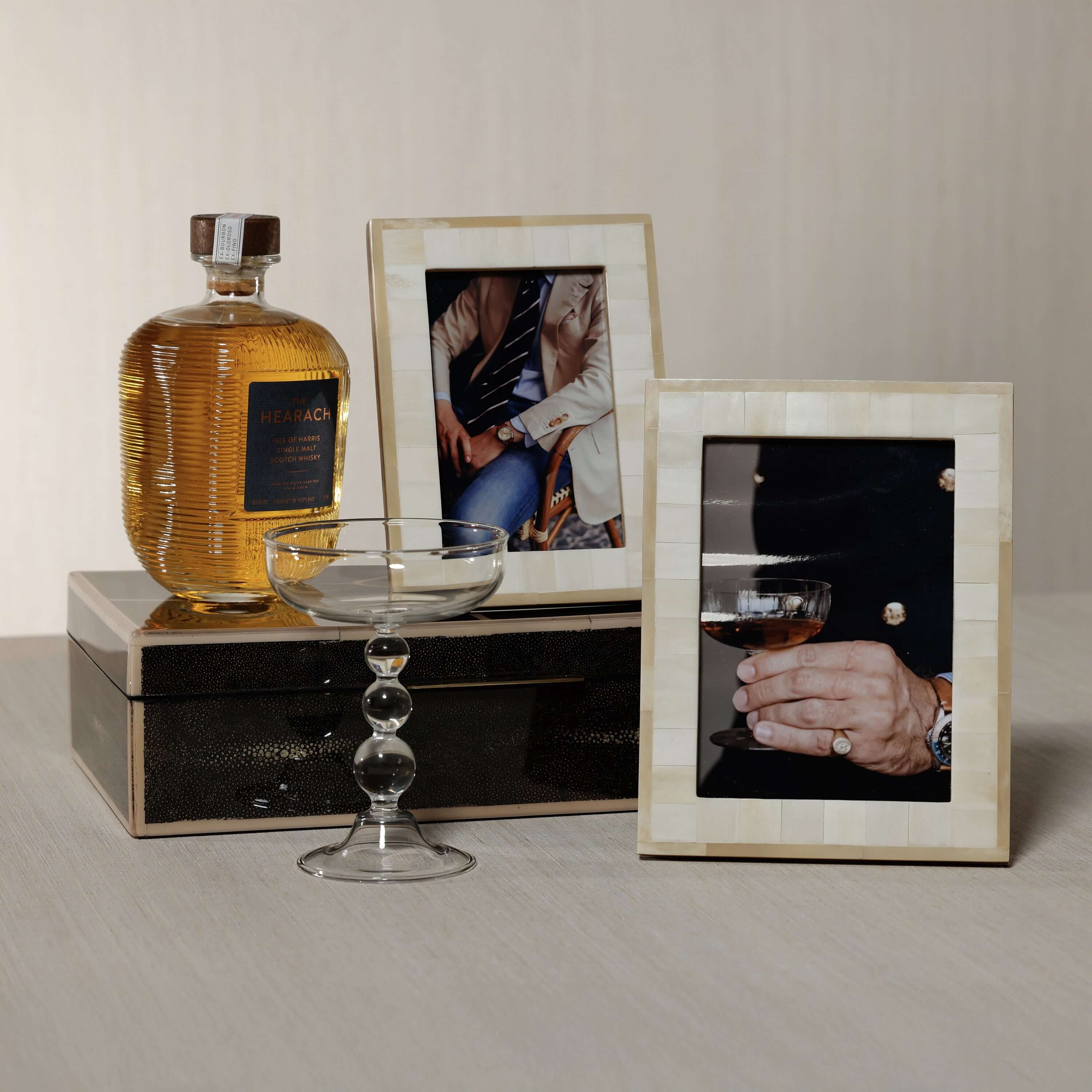 Dune Natural and Bleached White Bone Photo Frame displayed with drinks, elegant decor and lifestyle elements.