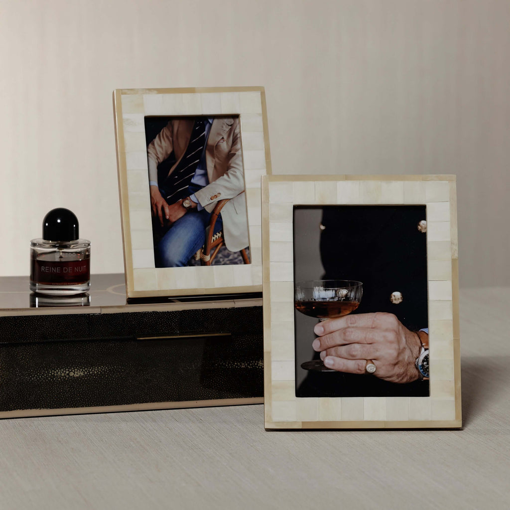 Dune Natural and Bleached White Bone Photo Frame displaying stylish images on a modern table.