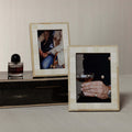 Dune Natural and Bleached White Bone Photo Frame displaying stylish images on a modern table.
