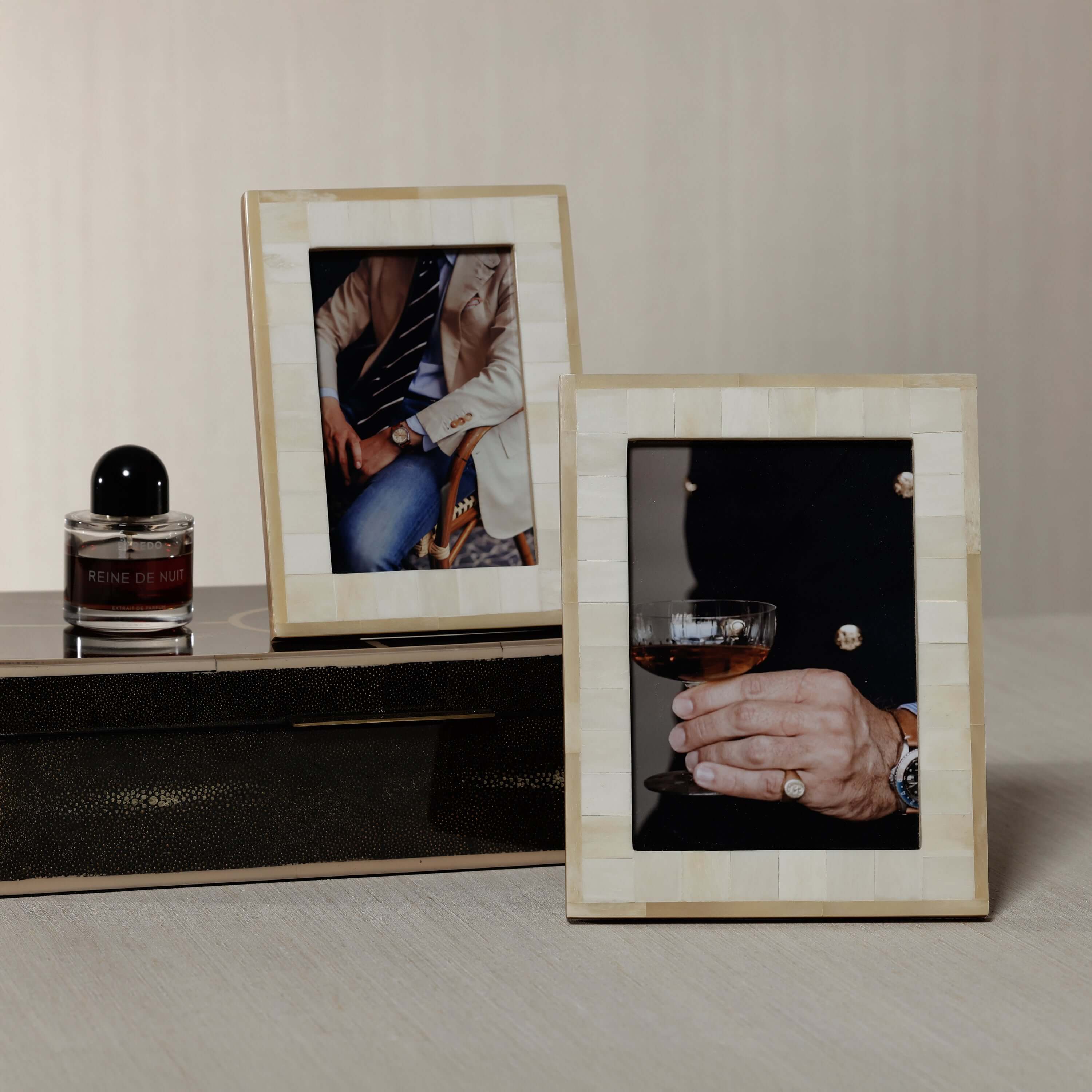 Dune Natural and Bleached White Bone Photo Frame displaying stylish images on a modern table.