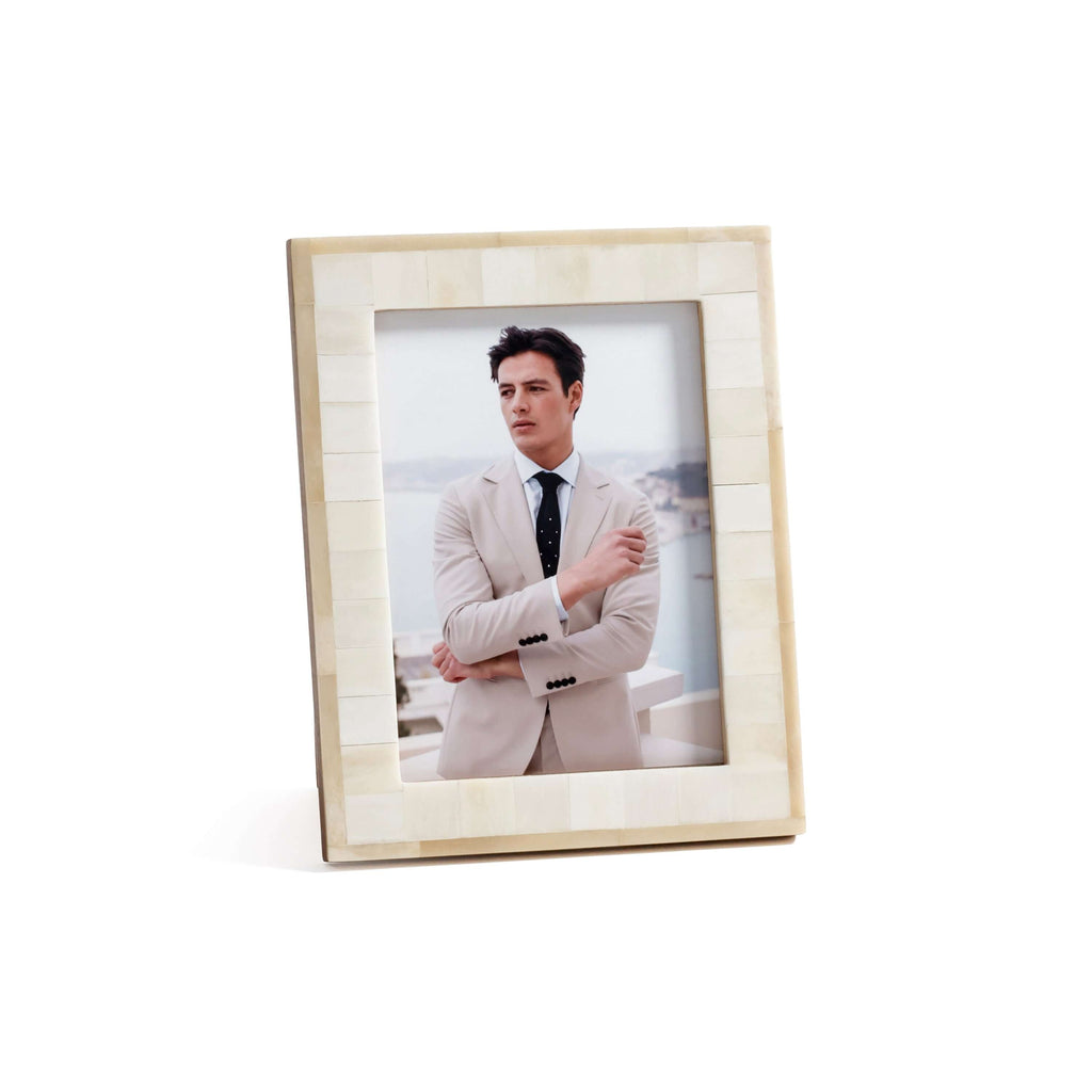 Dune Natural and Bleached White Bone Photo Frame showcasing a man in a suit against a scenic backdrop.