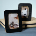 Black Resin Ribbed Photo Frame with Brass Accent showcasing modern elegance with ribbed texture and brass inner border.