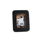 Black Resin Ribbed Photo Frame with Brass Accent showcasing a photo with a stylish outfit and accessories.