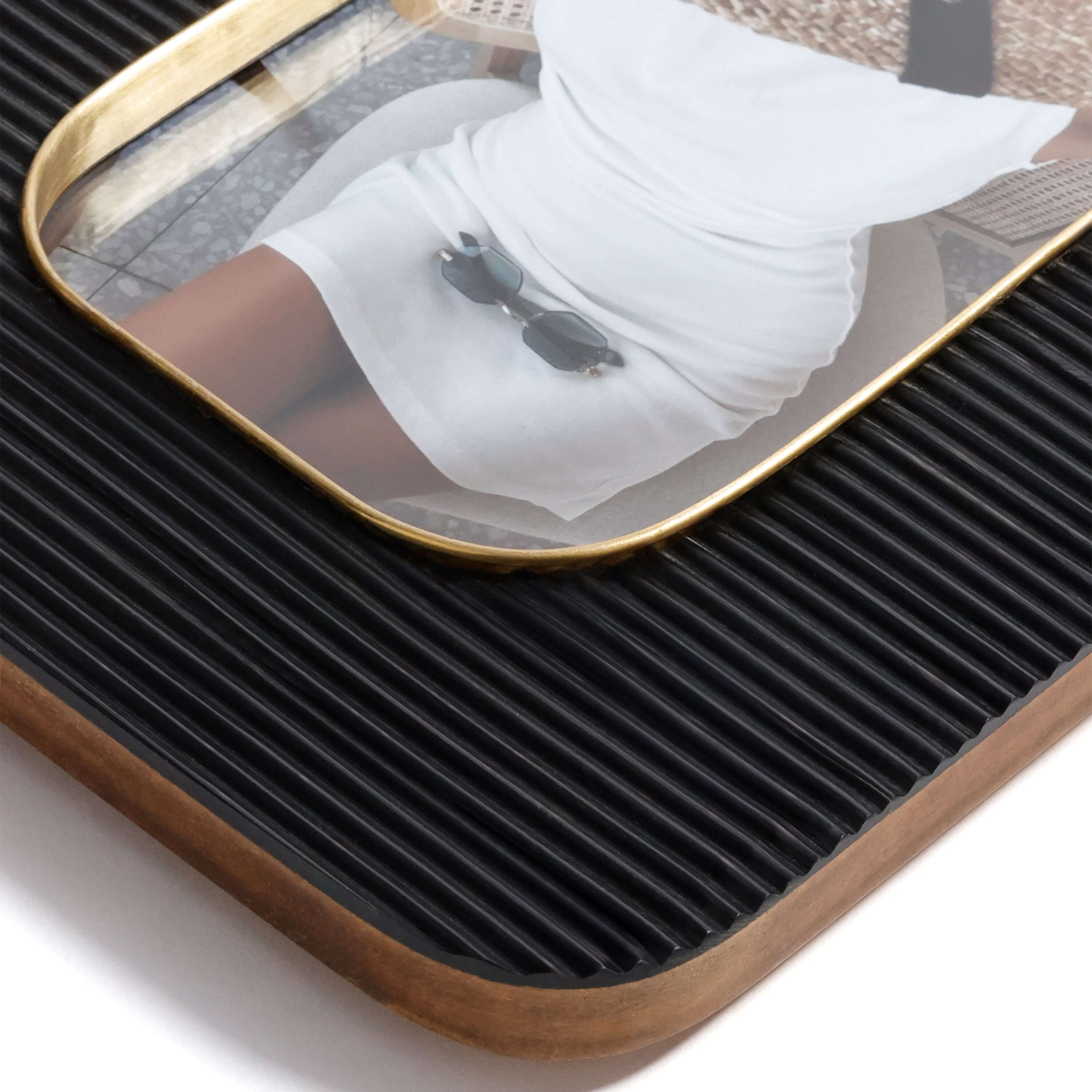 Black Resin Ribbed Photo Frame with Brass Accent featuring textured surface and rounded edges.