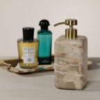 Crema Fossil Marble Bath Collection soap dispenser with a stylish design and warm cream tones.