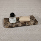 Marrón Emperador Marble Bath Collection tray with perfume and soap, enhancing bathroom elegance.