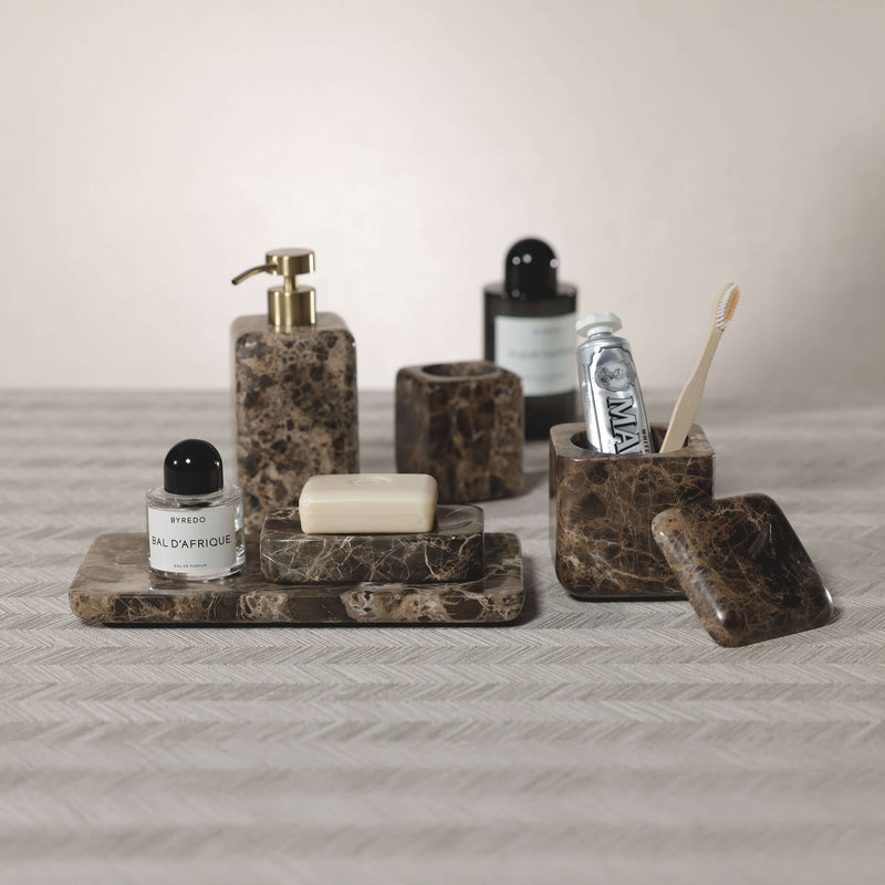 Marrón Emperador Marble Bath Collection featuring soap dispenser, trays, and toothbrush holder in rich brown marble.