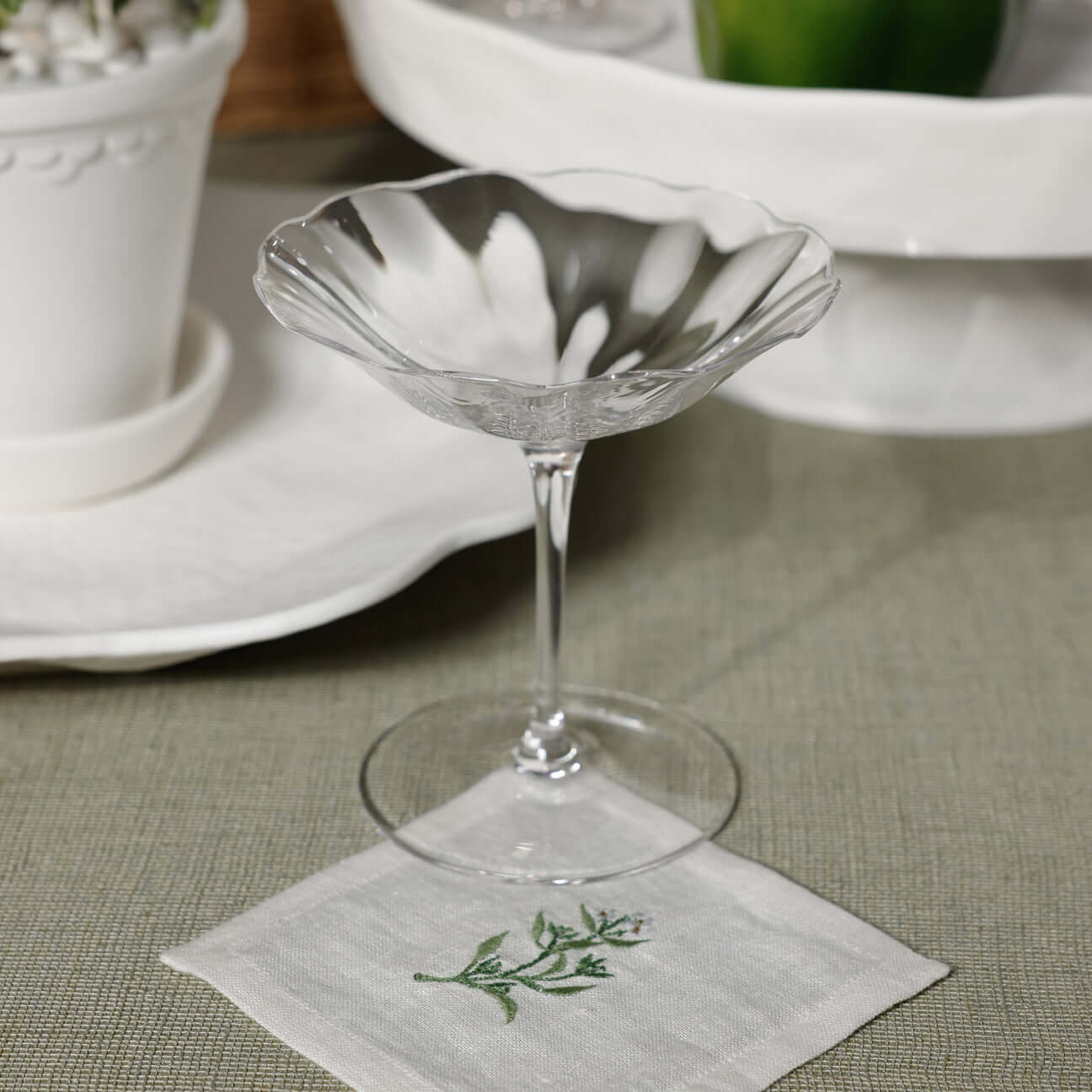 Floral Linen Cocktail Napkins - 6 Assorted Designs (Set of 6) with a decorative glass on a table setting.