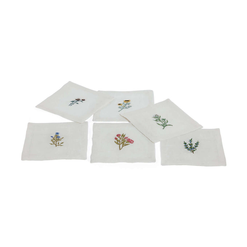 Floral Linen Cocktail Napkins - 6 Assorted Designs (Set of 6) featuring delicate floral motifs on white linen.